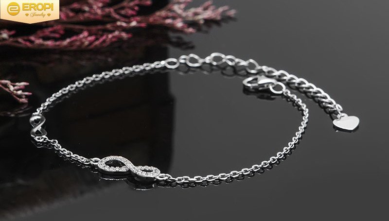 Thiết kế vòng tay vô cực đôi trên nền bạc trắng sáng, biểu tượng gắn kết