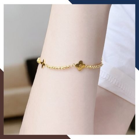 Lắc tay bi vàng 10K mix charm hoa 4 cánh vàng tinh tế