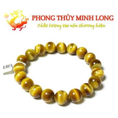 Vòng tay đá mắt hổ vàng tâm với hiệu ứng mắt mèo rõ nét, một yếu tố quan trọng ảnh hưởng giá vòng tay đá mắt hổ