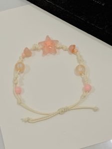 Vòng tay dây rút handmade màu tím với hạt acrylic hình ngôi sao nổi bật