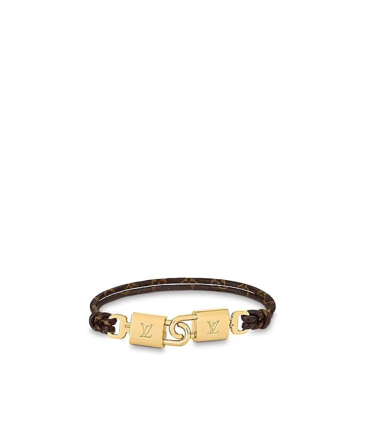 Vòng tay Louis Vuitton Twinlocks Bracelet với khóa ổ khóa độc đáo và dây đeo canvas.